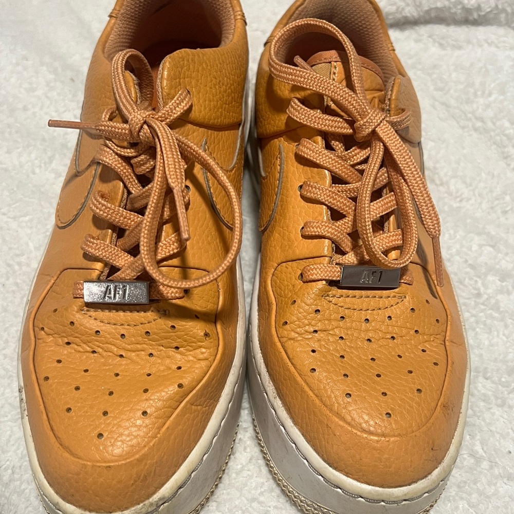 68. Kid’s Orange Leather Jordan’s Sneakers
